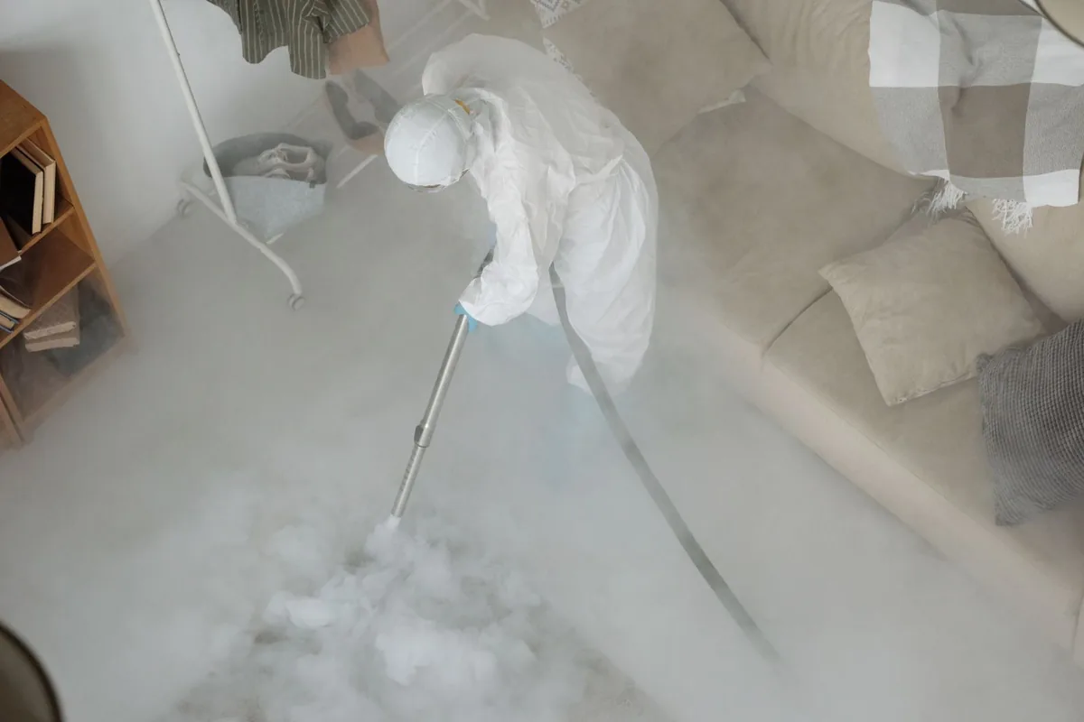 Biohazard cleanup technician in protective equipment, Juneau, WI